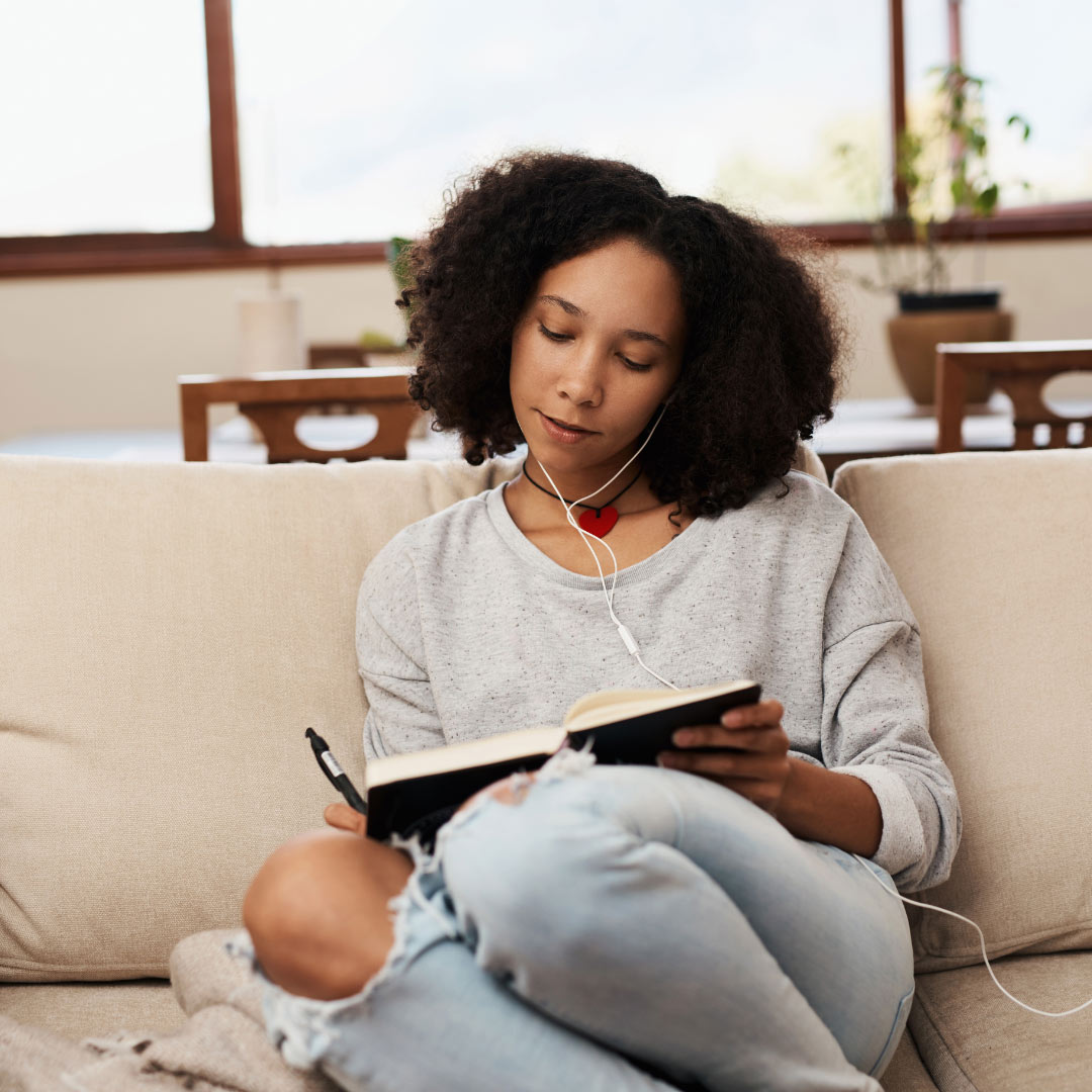 black woman journaling traumatic memories